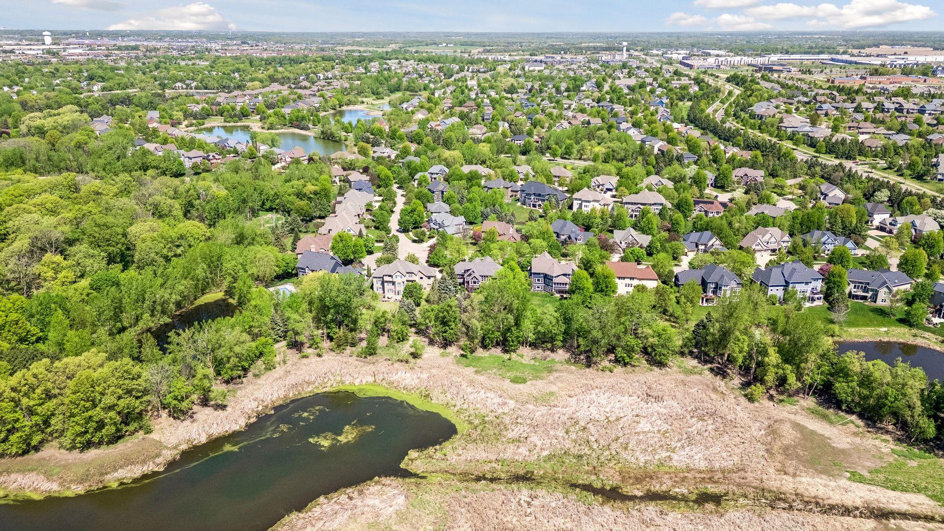 The home backs up to Fish Lake and wetlands, creating a private setting.