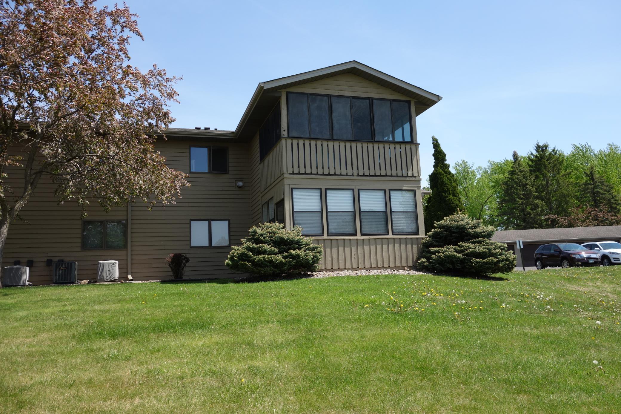 This lower level unit has a fantastic 3 season porch to the rear, offering a great place to enjoy the outdoors and provides so much light.
