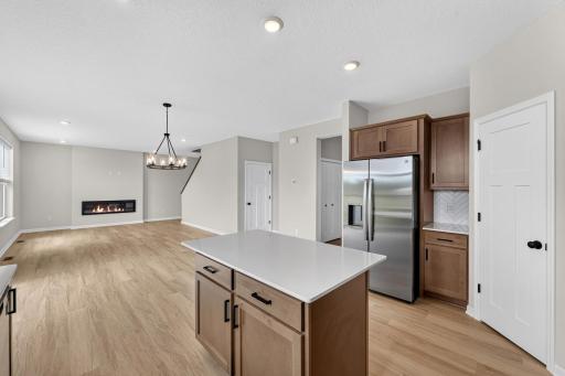 Kitchen adjacent to dining area and family room