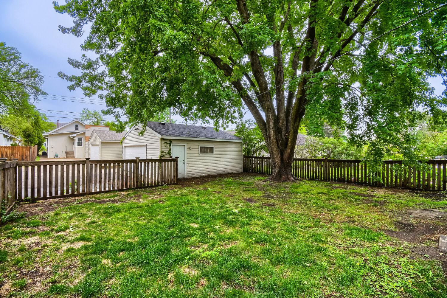 Large fenced in back yard with so much gardening potential!