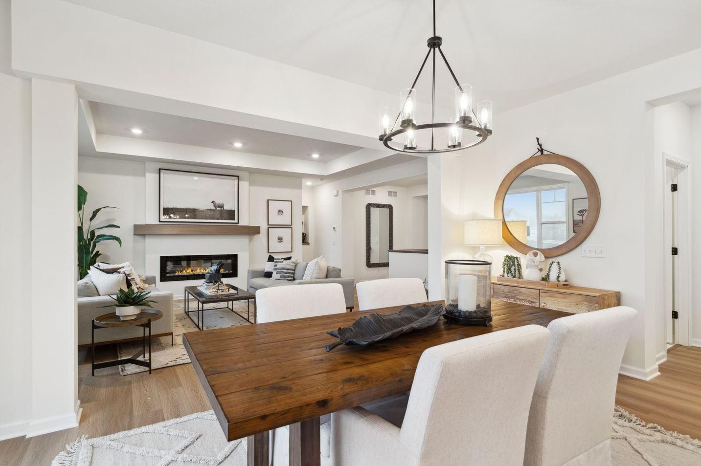 The family room seamlessly connects to the dining room so everyone can feel connected yet have room to spread out. Photo of model home, colors and options may vary. See listing agent for details.