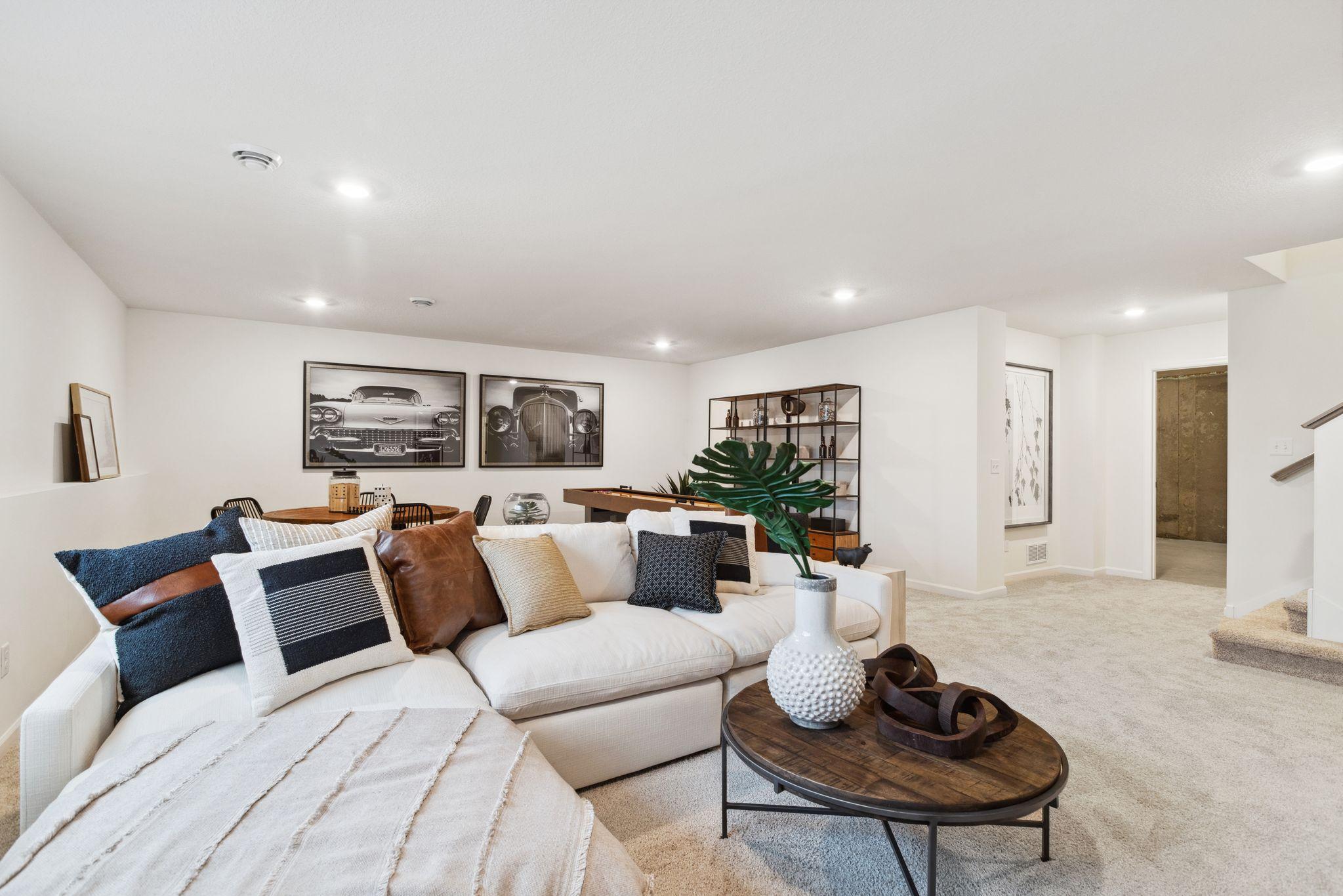There is tons of room to entertain with two large gathering spaces in the home, plus two additional bedrooms and a bathroom on your finished lower level. Photo of model home, colors and options may vary. See listing agent for details.