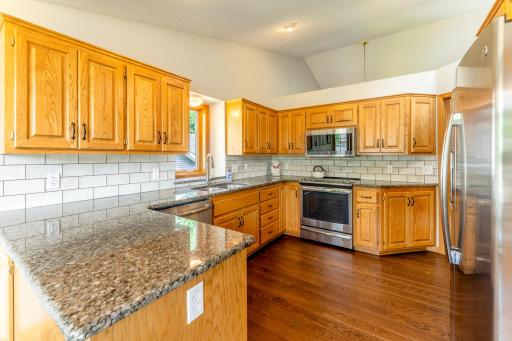 Stainless steel appliances and granite countertops.
