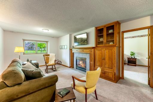 Lookout windows bring in natural light. Fireplace keeps the room warm and cozy. Built ins for added storage.