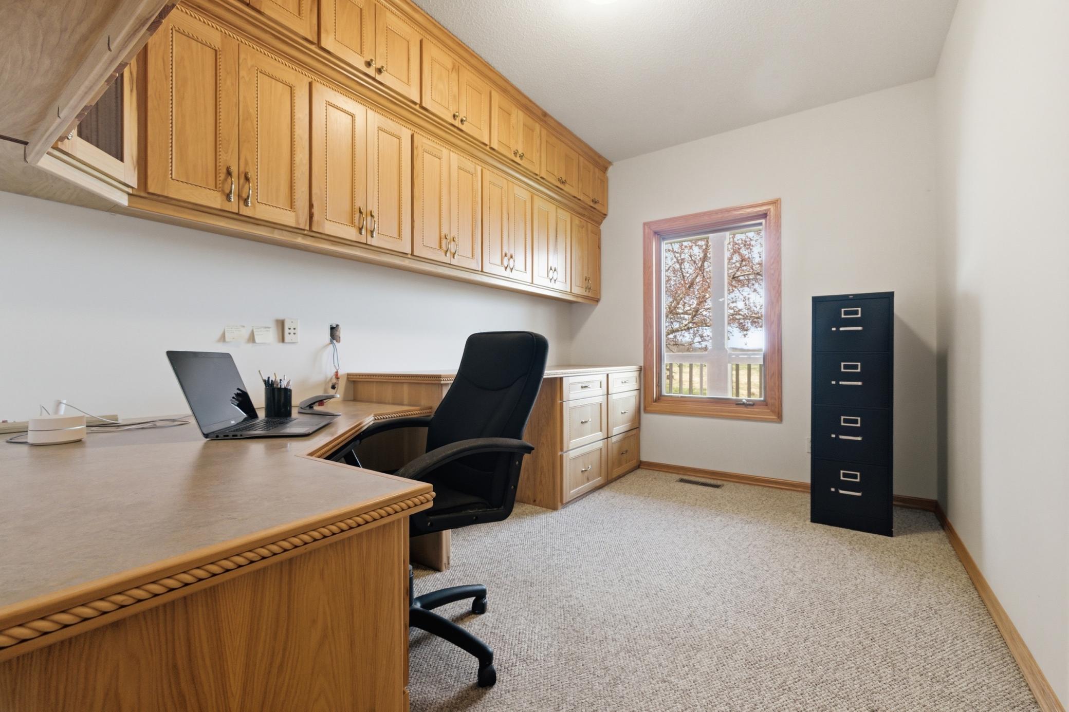 dedicated office space with plenty of custum cabinitry