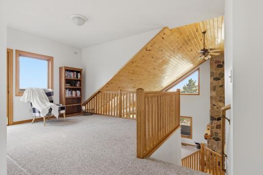 Upper level balcony overlooking living room/kitchen