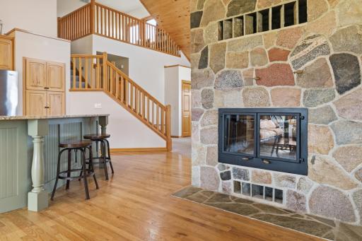 Two sided split rock wood burning fireplace