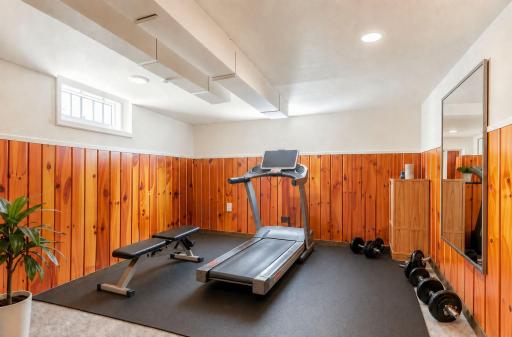 Same bonus room is virtually staged as a fitness room.