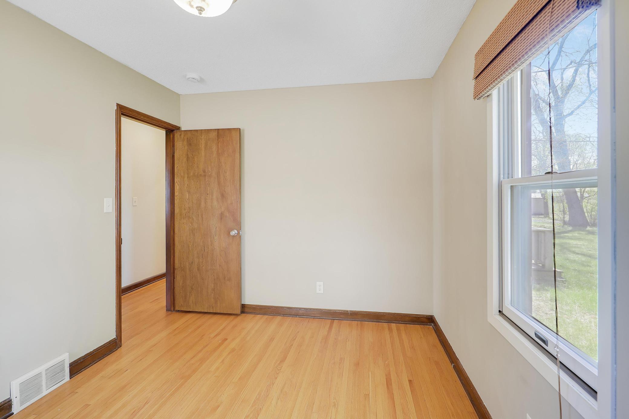Secondary Bedroom has a pleasant backyard view.