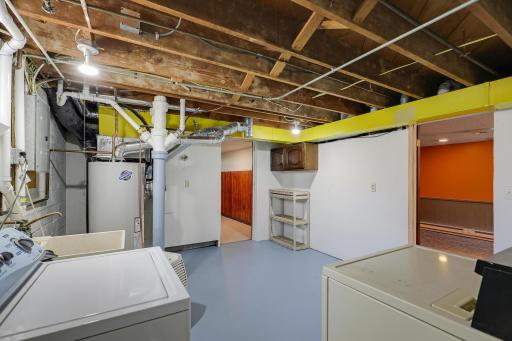Washer, dryer and laundry tub with sink & faucet are included.