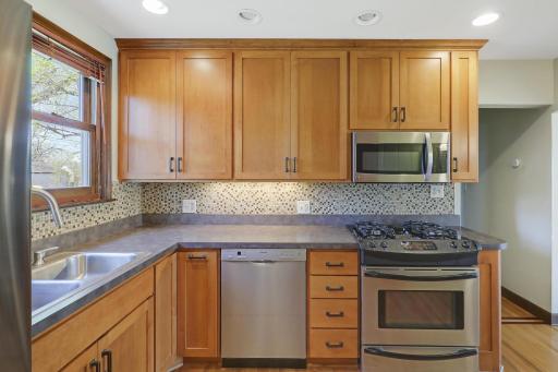 Showcases stainless steel appliances including a Bosch dishwasher.