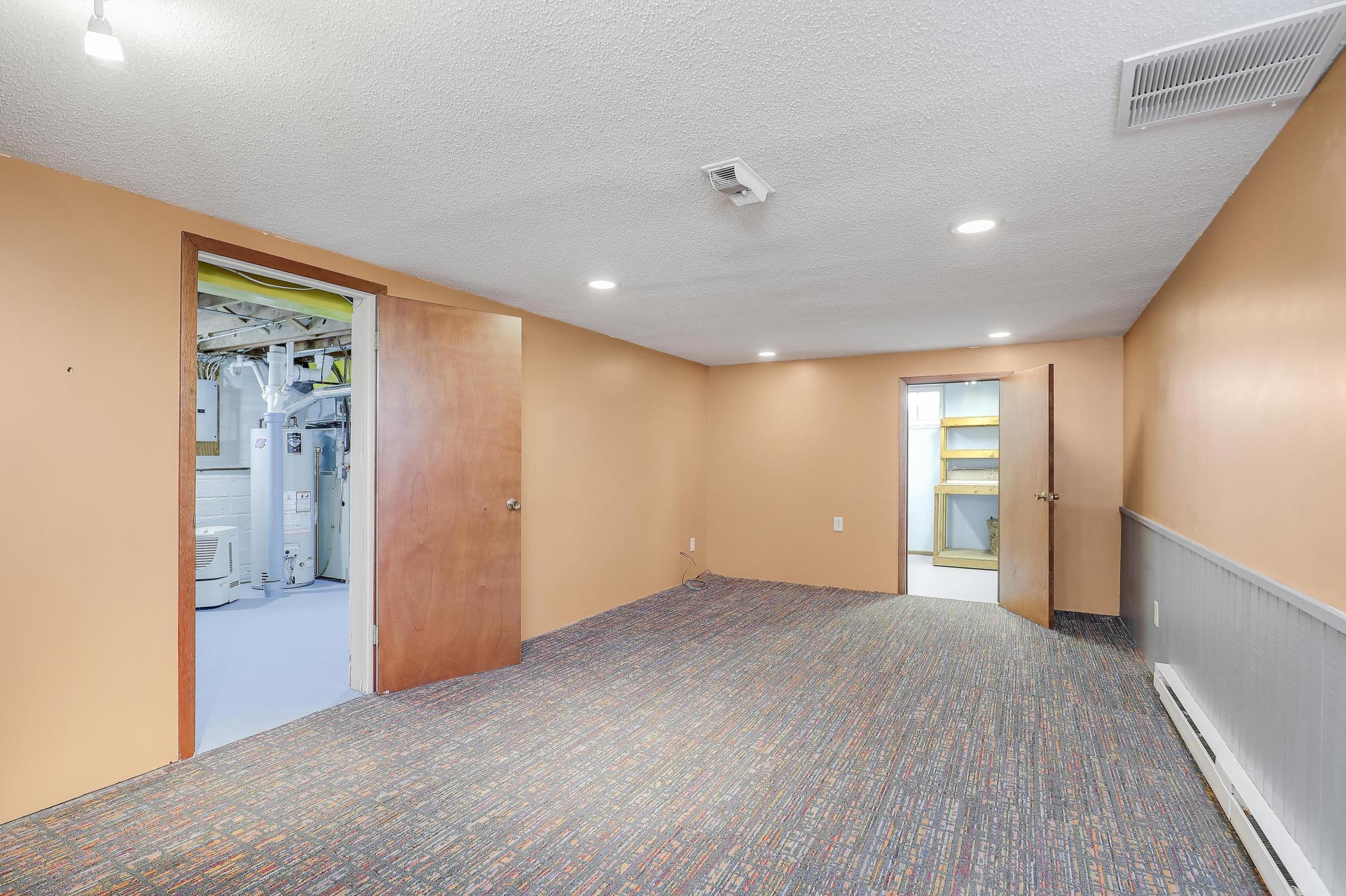 Family/rec room has easy access to storage and laundry.