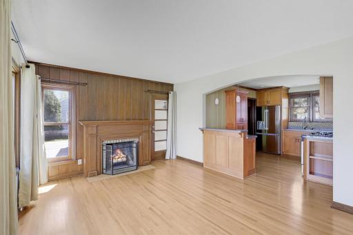 A central focus is this handsome fireplace and solid wood mantle.