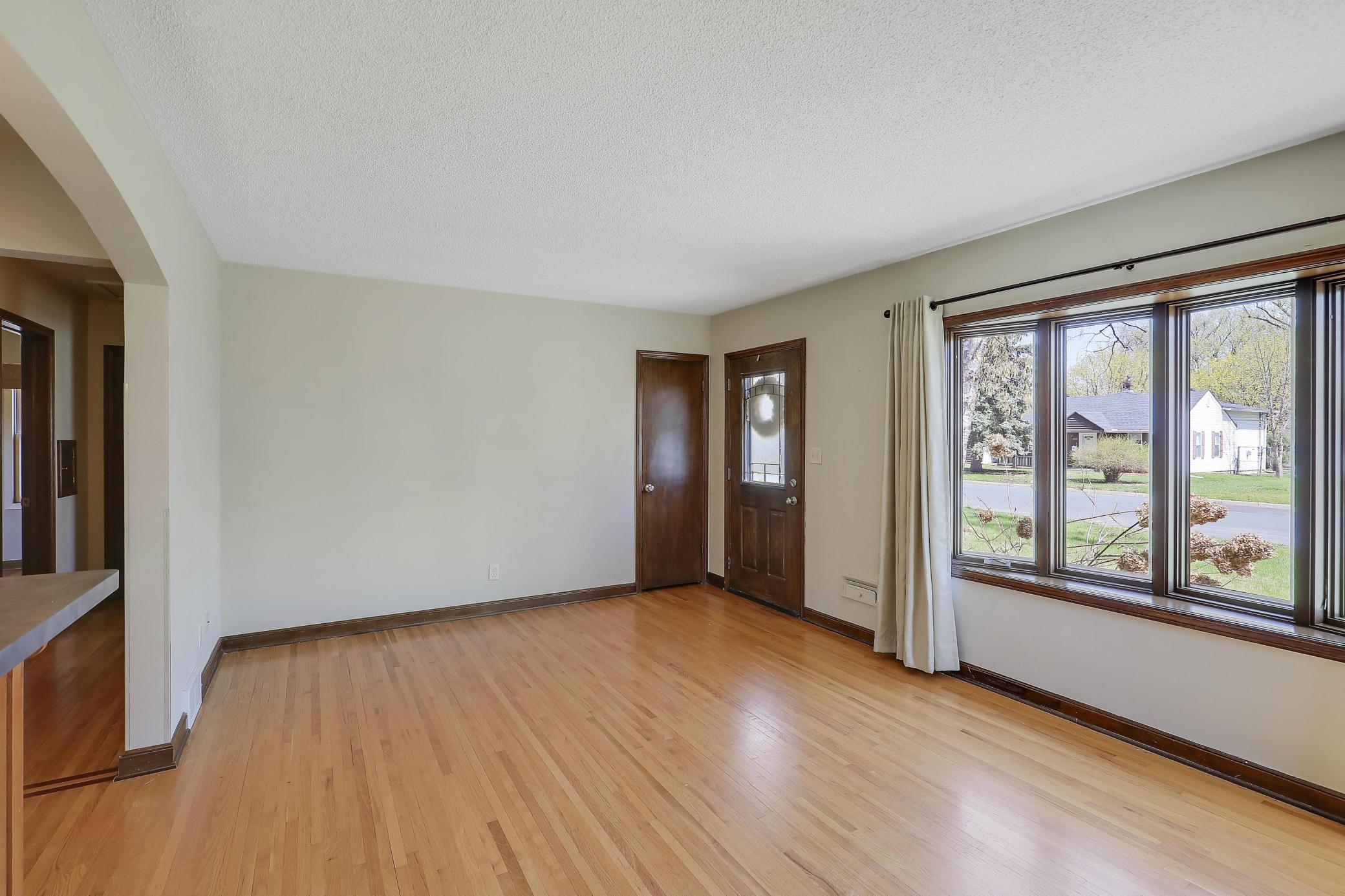Note the stunning bay window and decorative door.