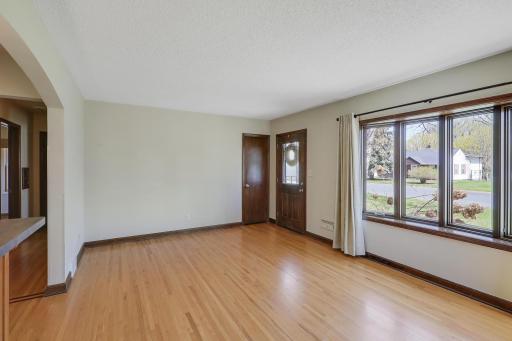 Note the stunning bay window and decorative door.