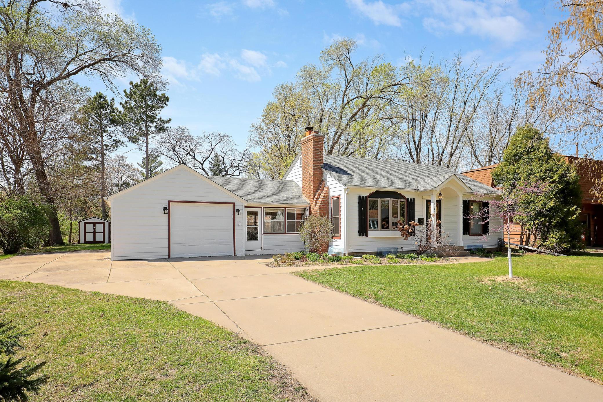It is so sensible to have a cement driveway and side parking or bonus patio space.
