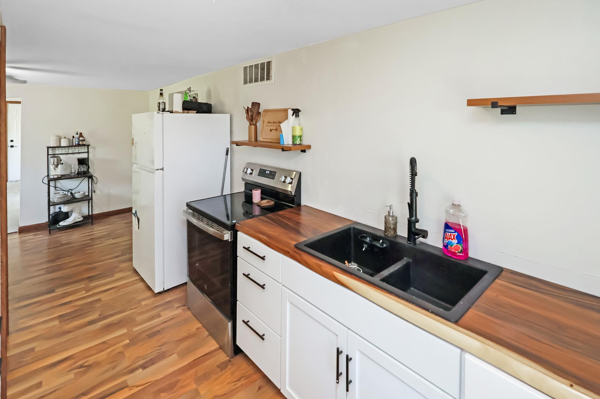 Brand new kitchen sink, countertops, and cabinets.jpg