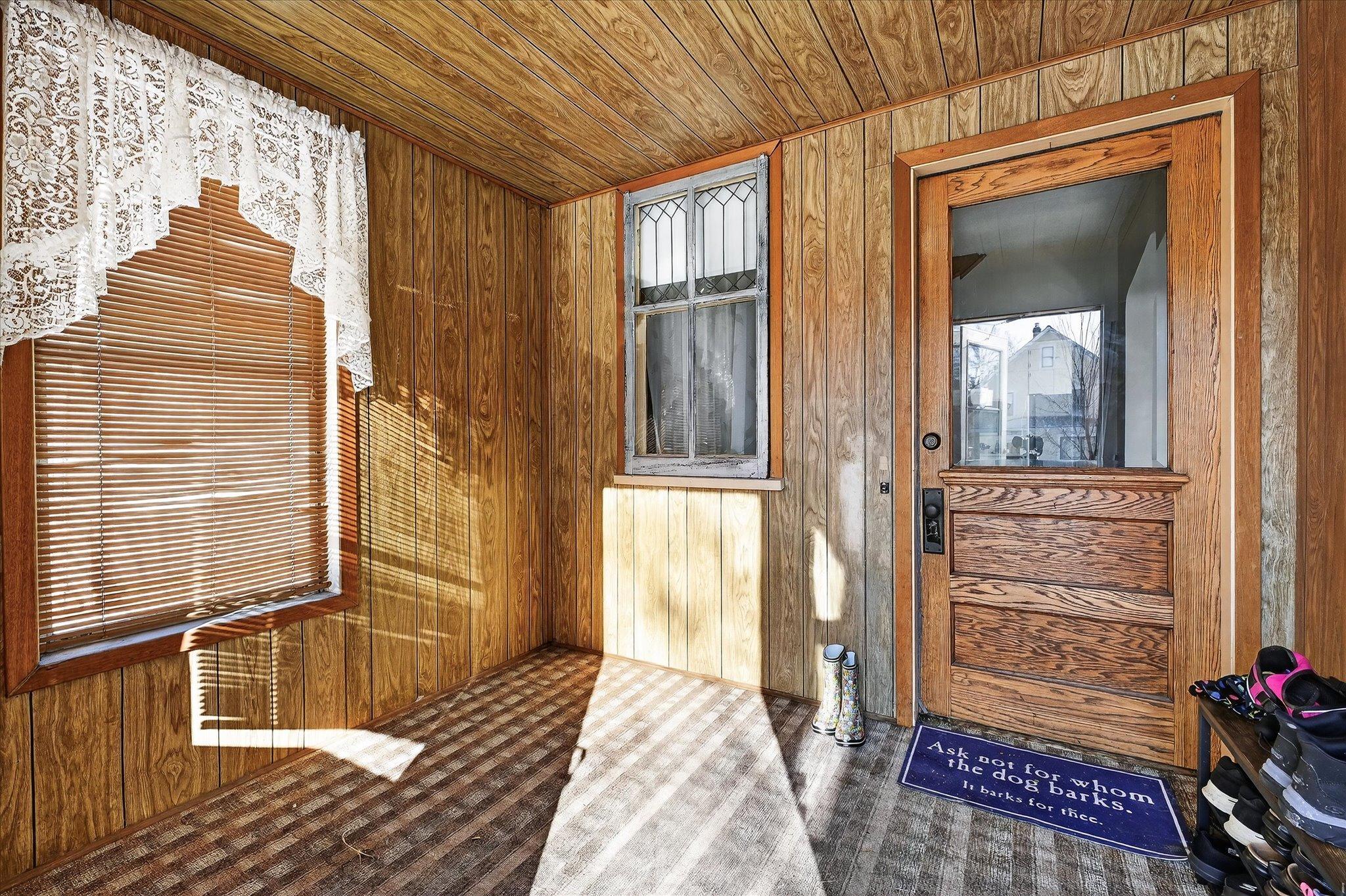 Cozy front porch with beautiful original door.