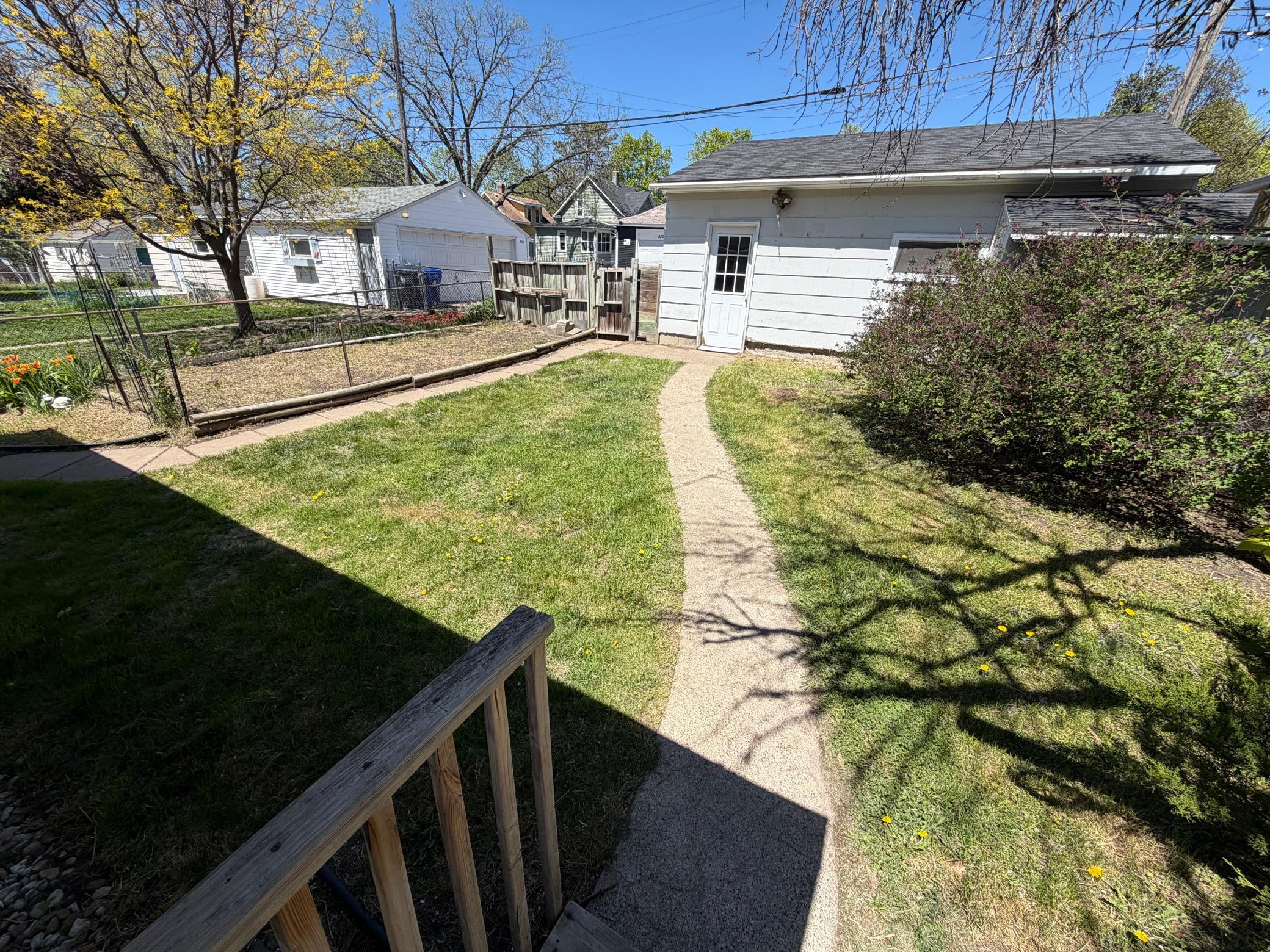 View from deck to the backyard & garage.