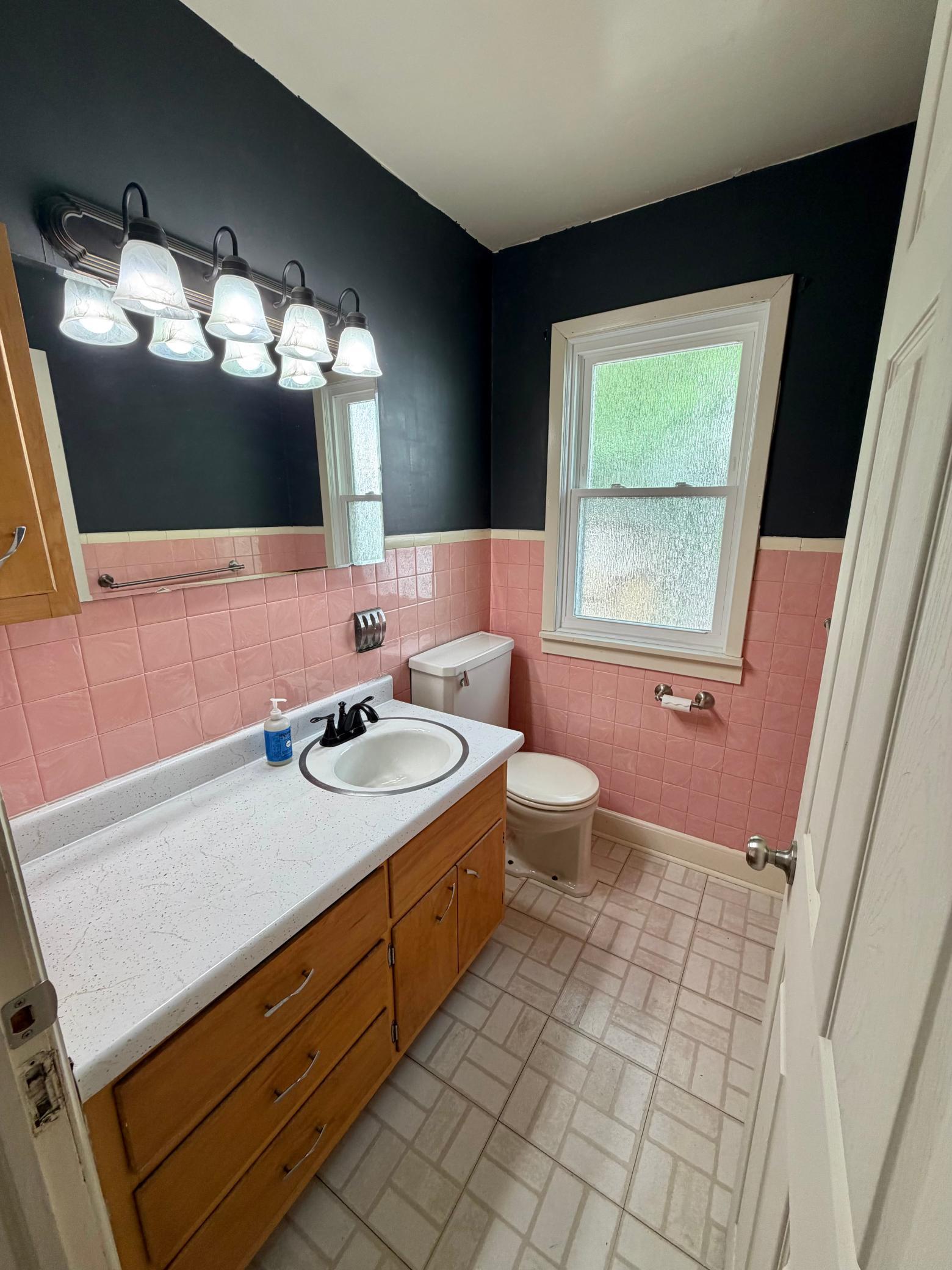 Main floor half bath with awesome retro vibes!