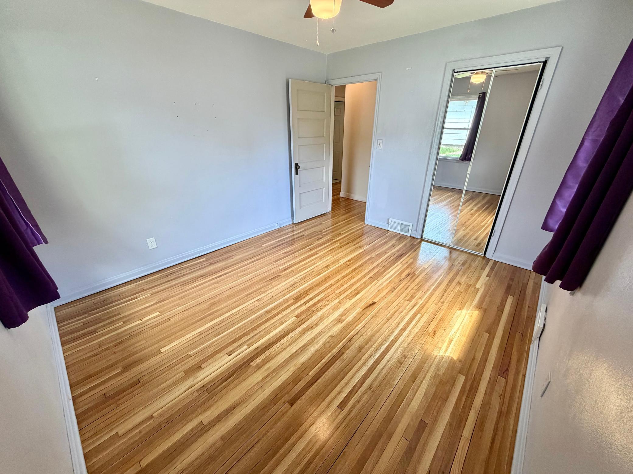 Another view of a main level bedroom.