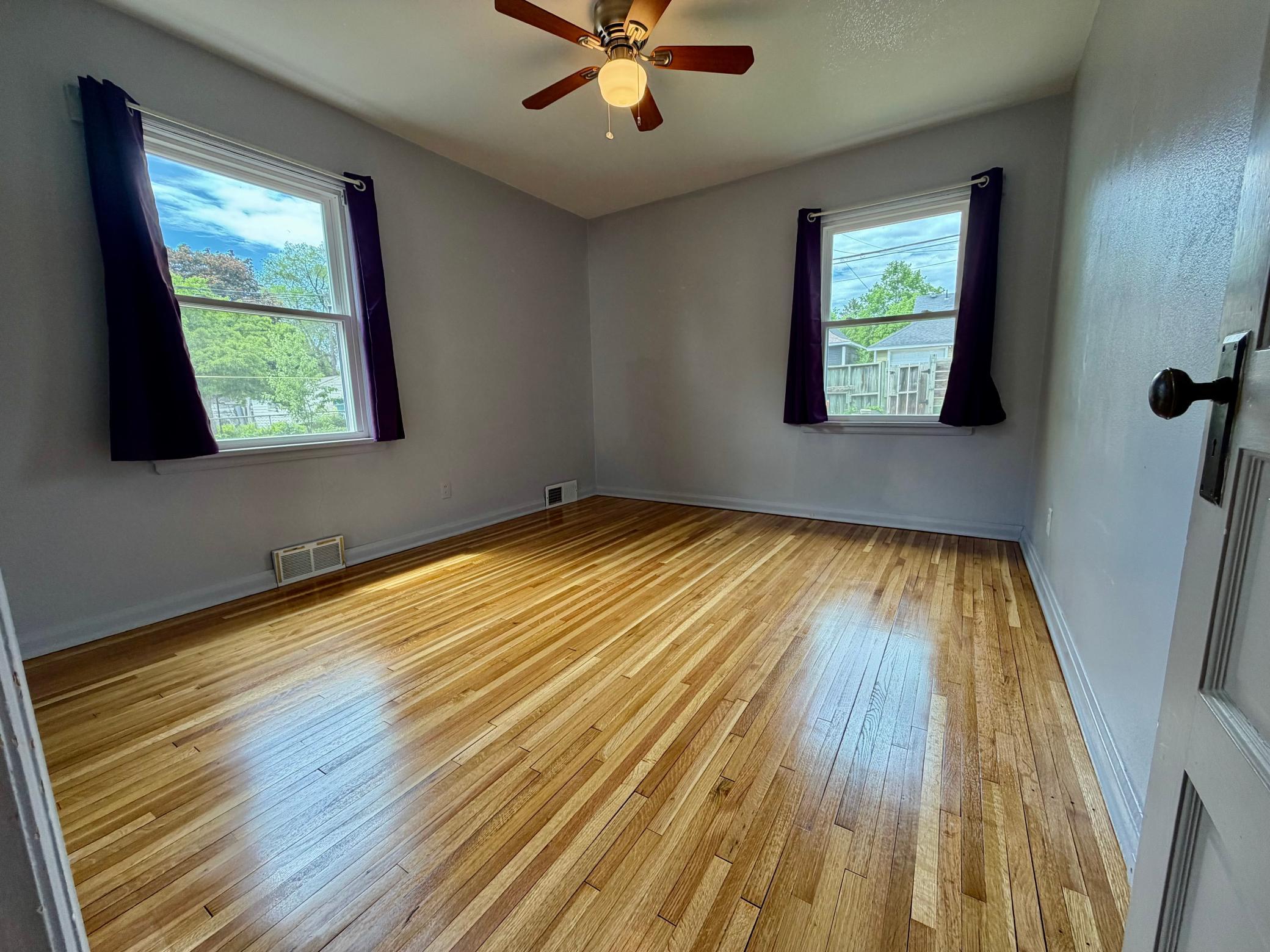 One of two main level bedrooms, both with gorgeous oak hardwood floors.