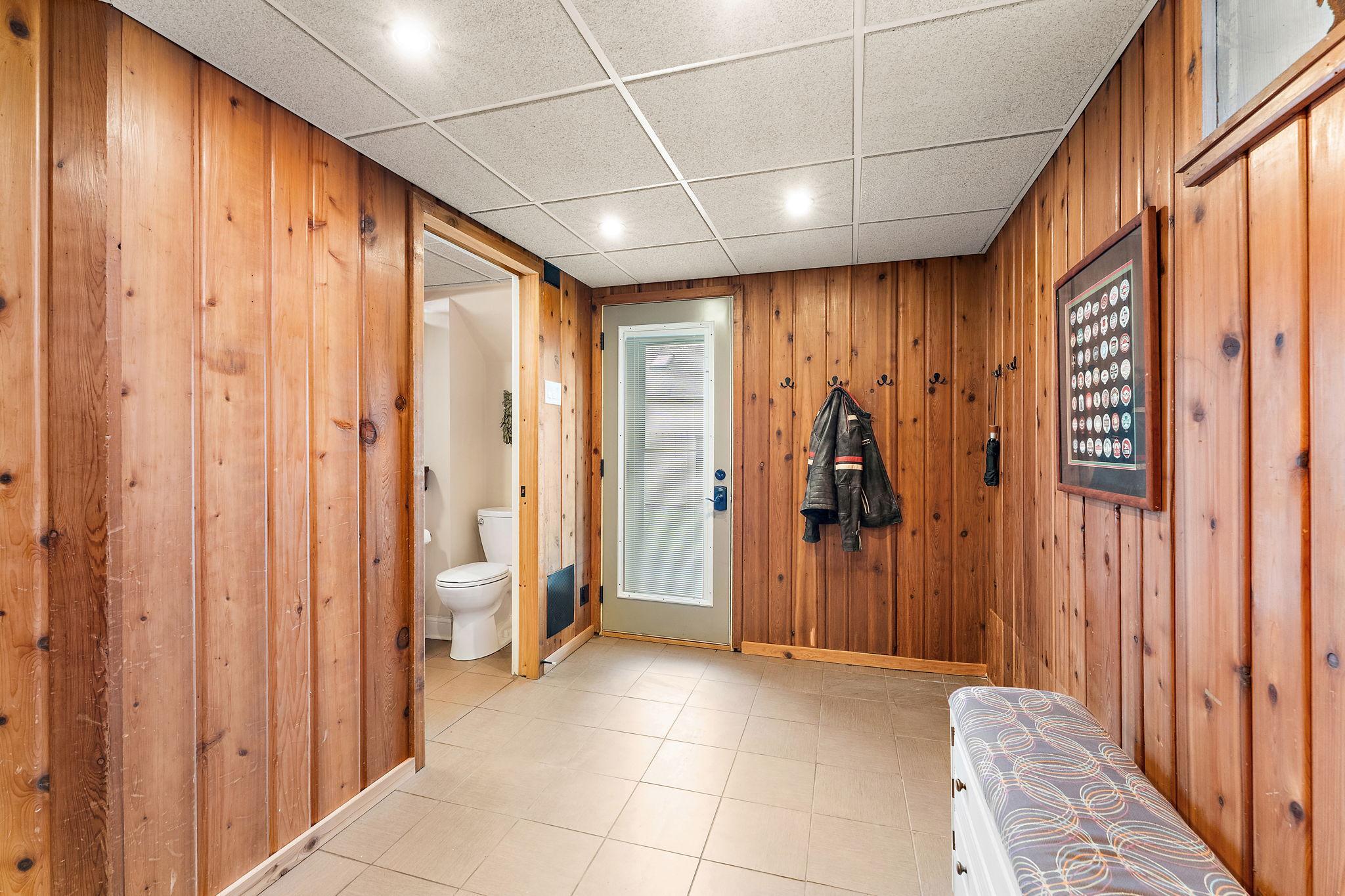 Tiled floor mudroom in the lower level walkout