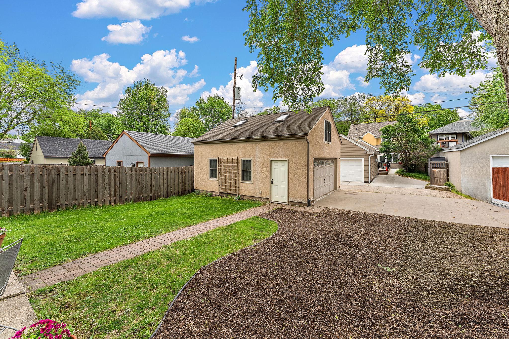 2 car garage with concrete driveway