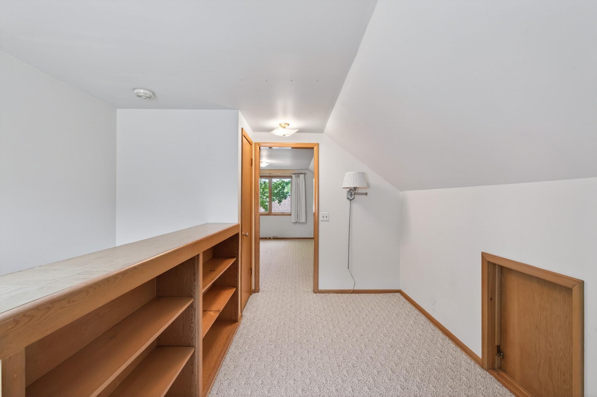 Nice wood built in shelving upstairs.