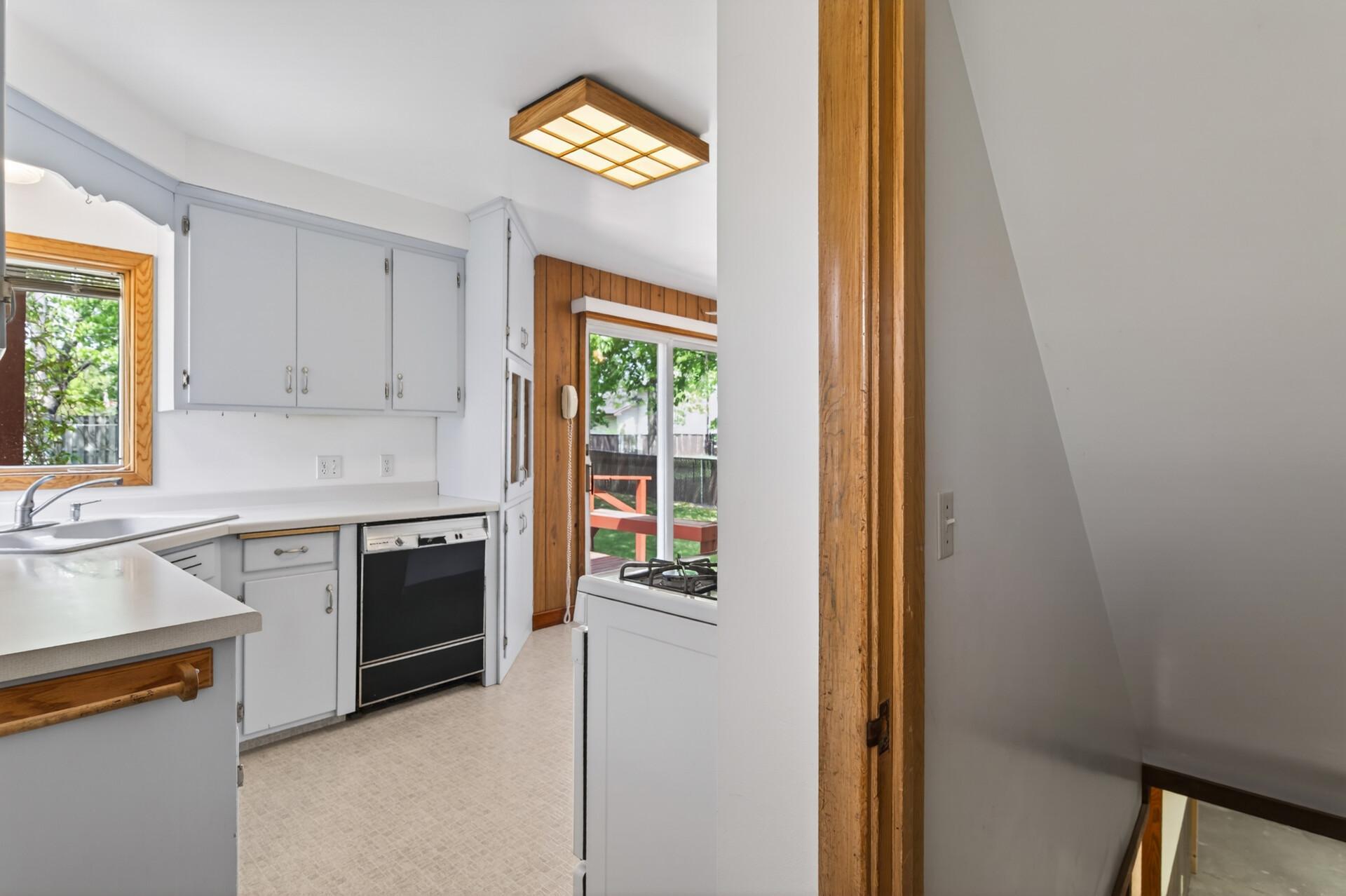 The side entrance from the garage into the kitchen and you can go down to the basement.