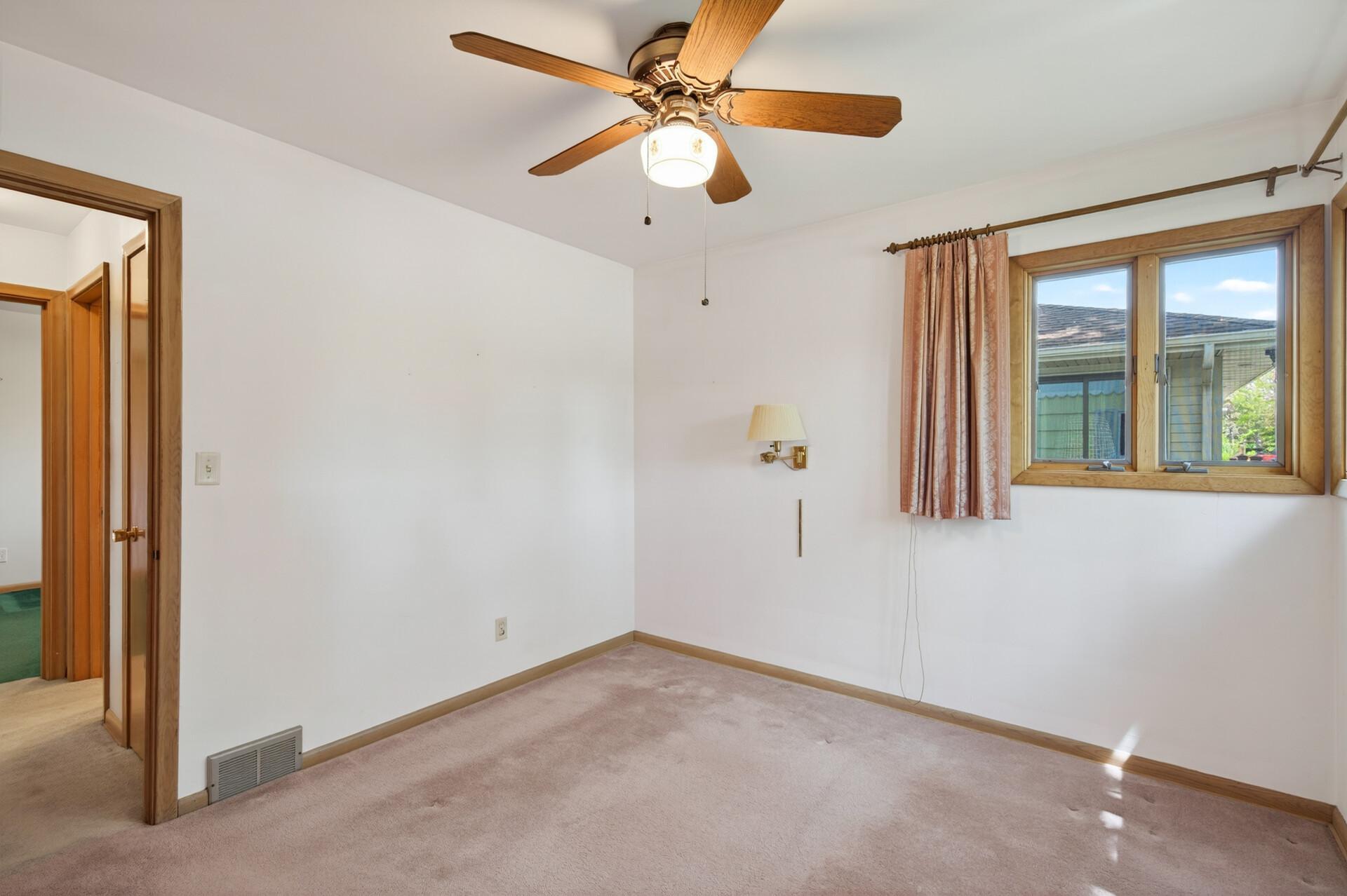 Another view of the primary bedroom.