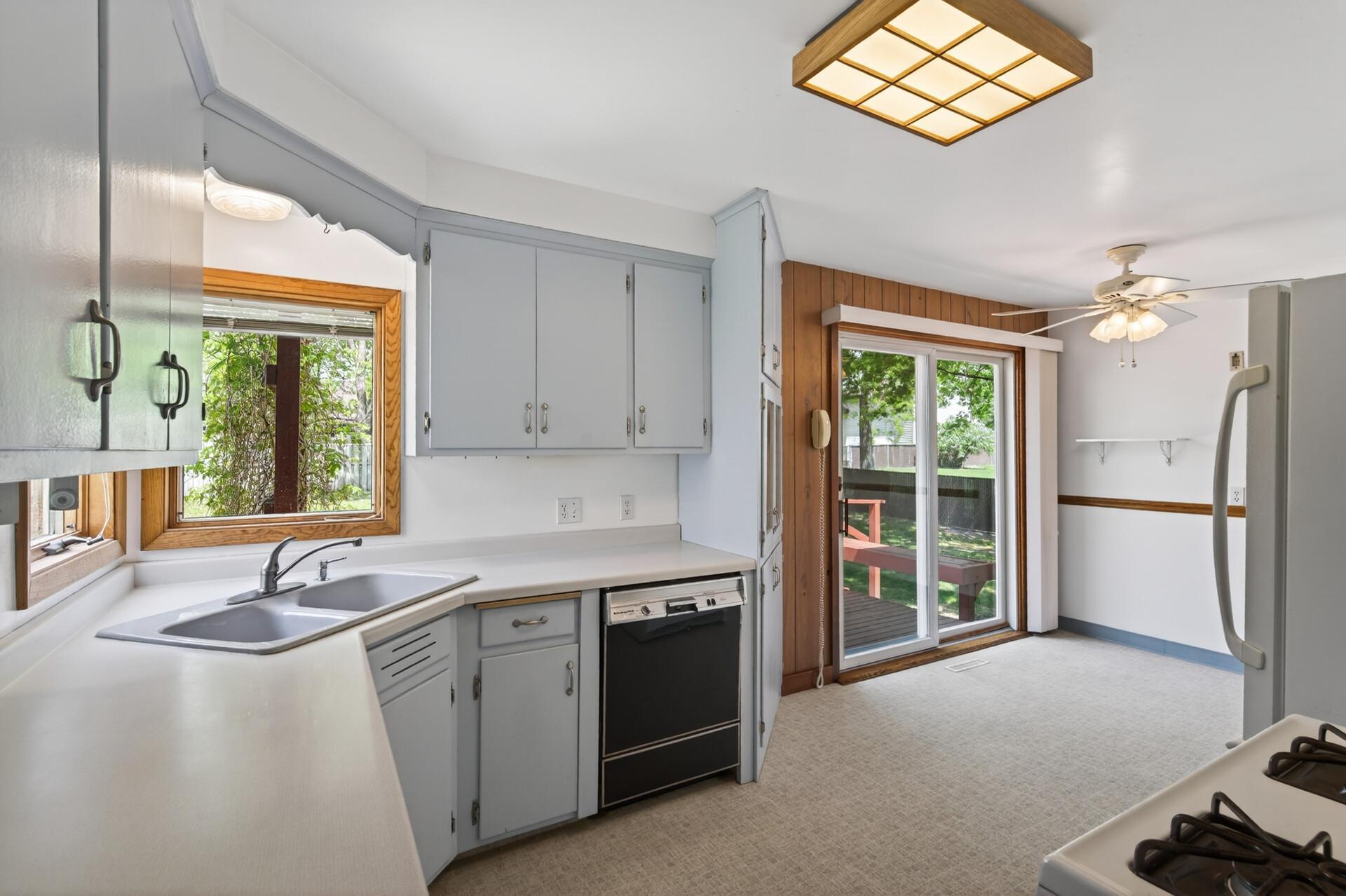 There is a corner sink with split casement windows for lots of natural light.