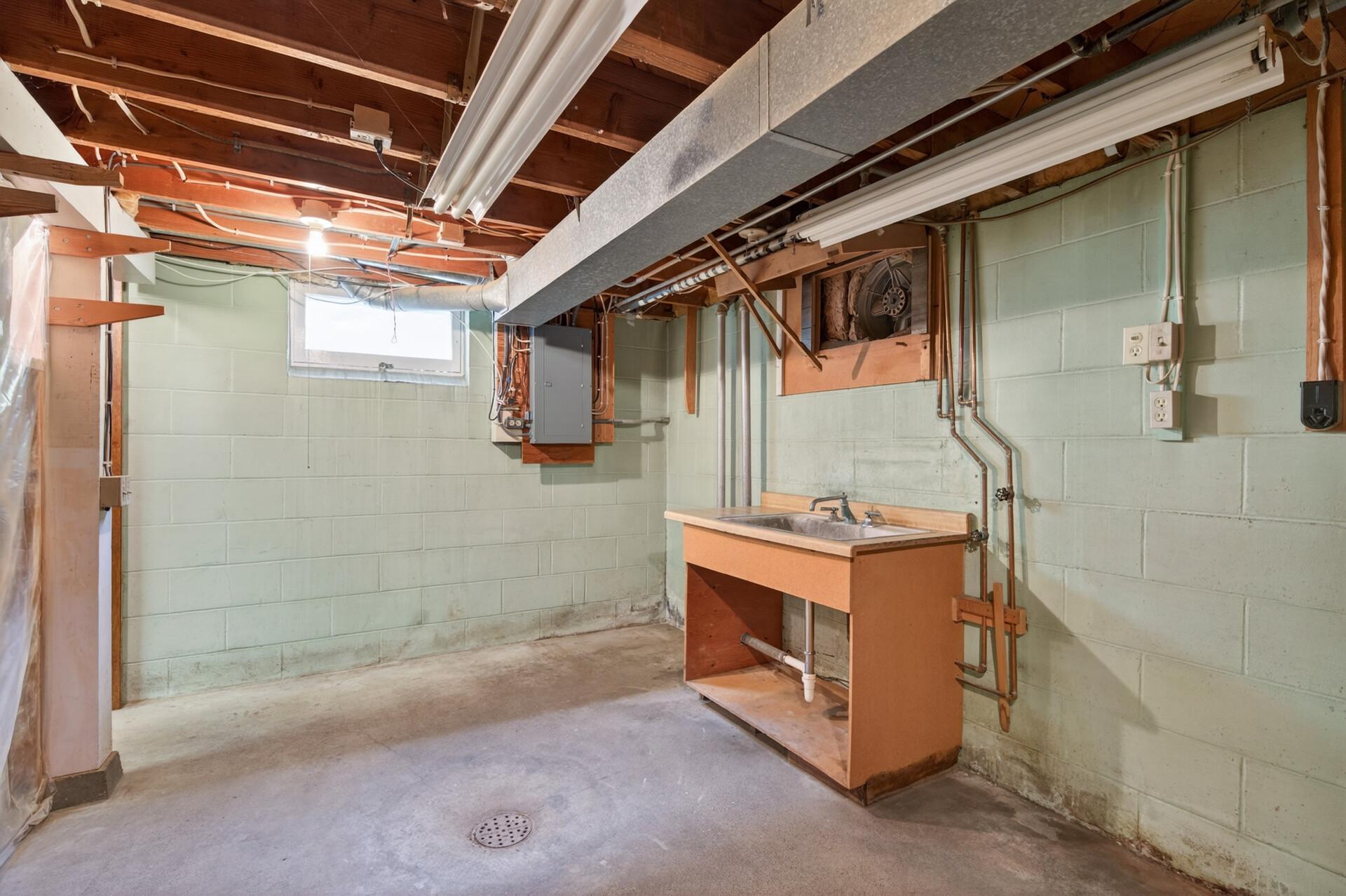 Additional sink and storage space in the basement, 200 amp breaker panel.