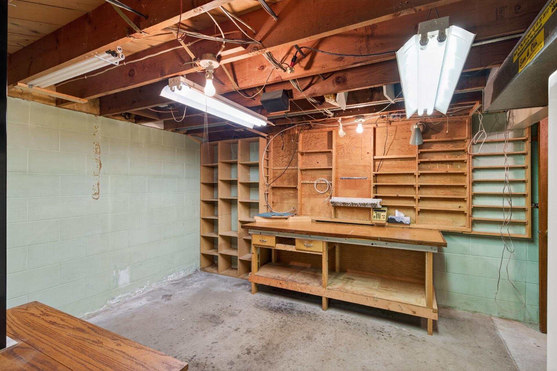 The seller will leave the workbench and shelving.