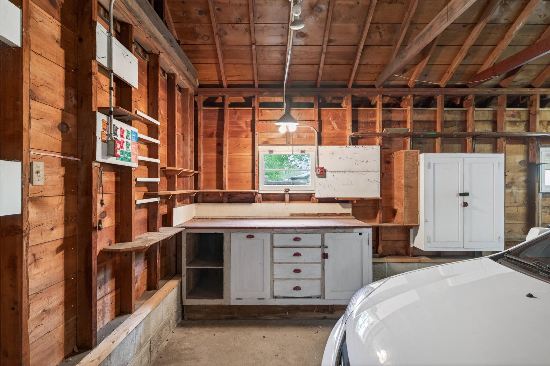 A work bench and storage cabinet.