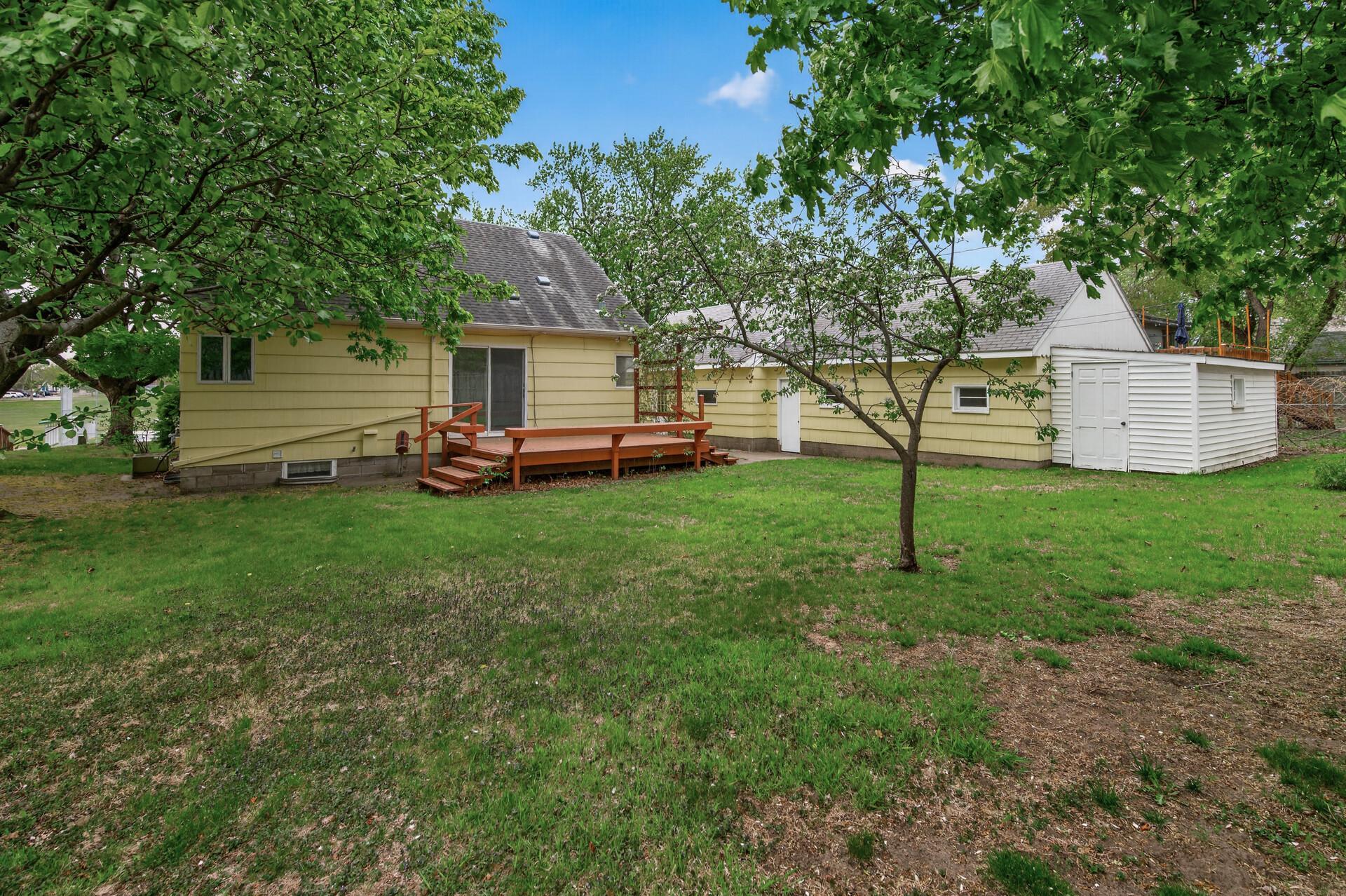 A backyard view of the house and the 14x12 redwood deck.