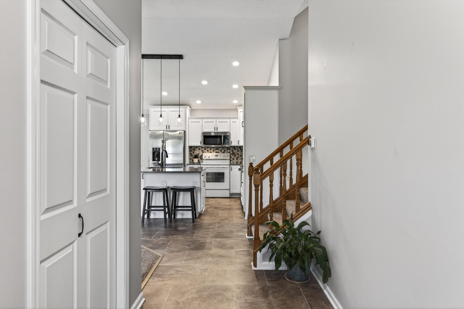 Large foyer leads to the beautiful new kitchen, new flooring, and trim work throughout the main level.