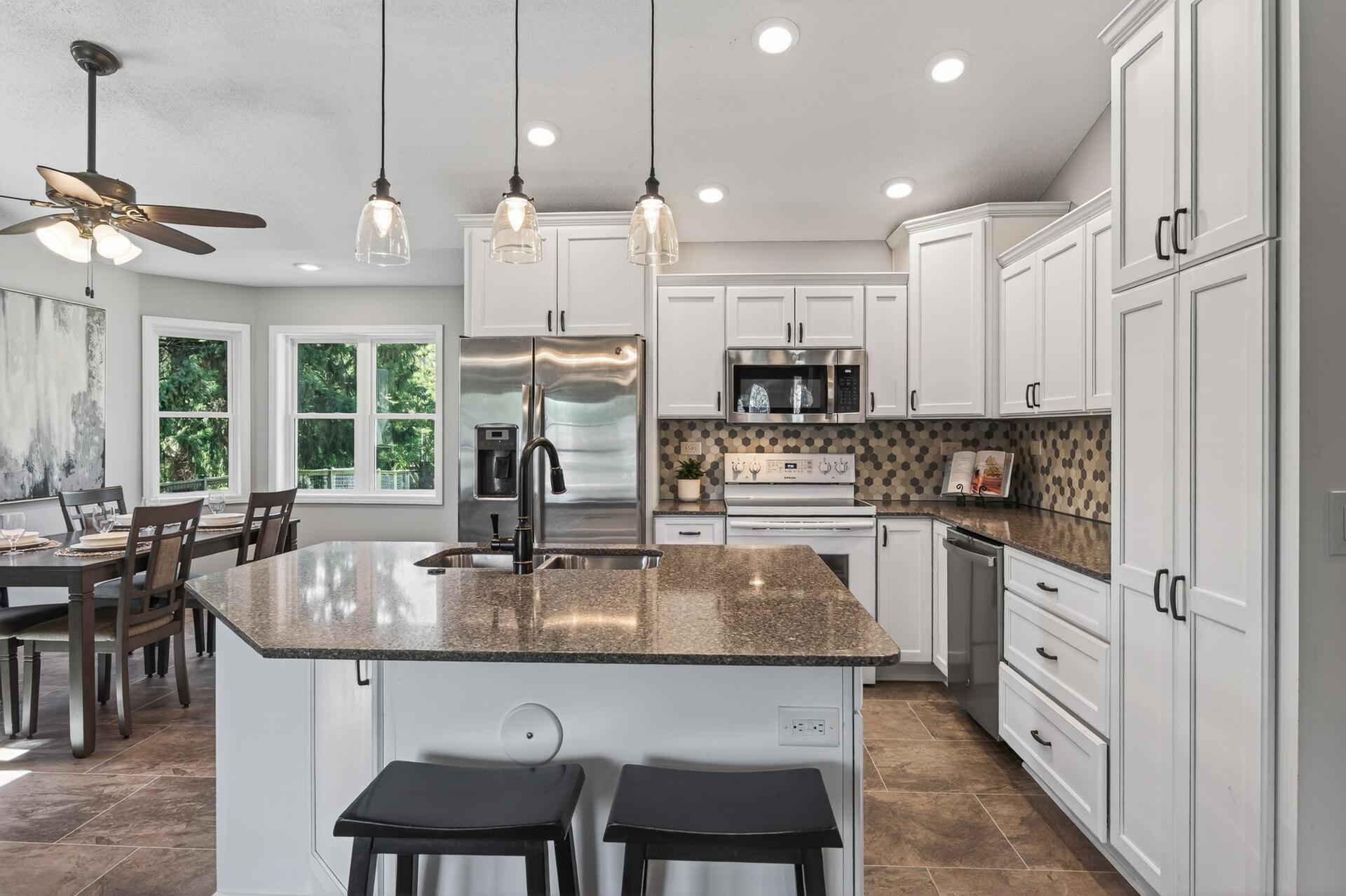 Fully remodeled kitchen filled with light.