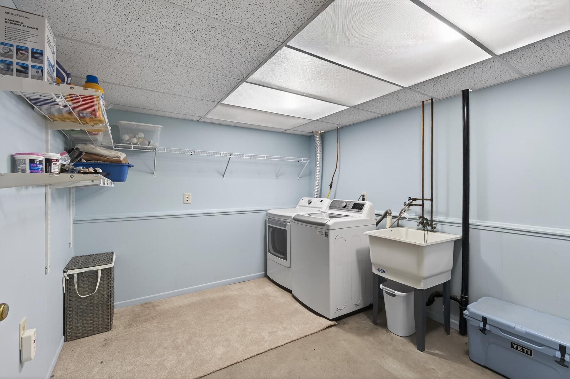Large laundry and utility room in lower level.
