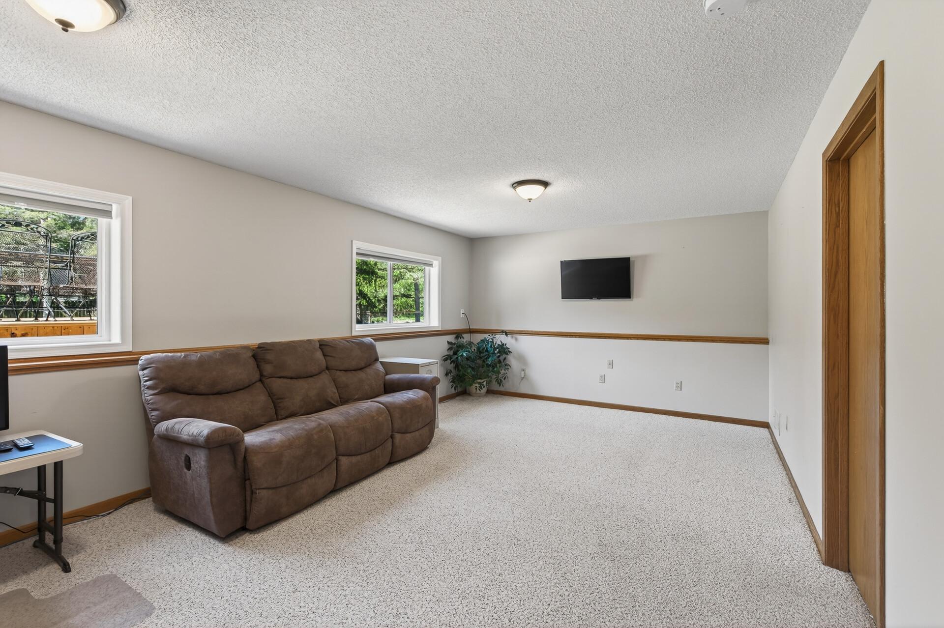 Please note: There is no outlet behind the TV or in-wall system for cords.