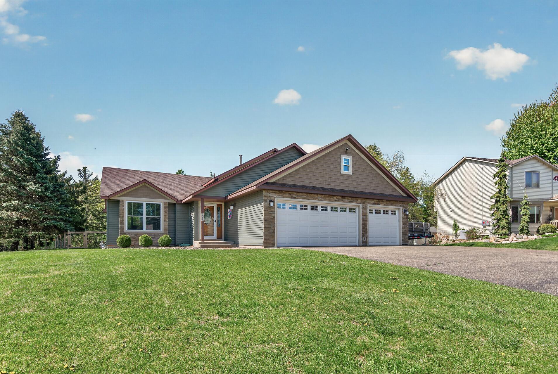 Front of home was recently re-sided, adding decorative stone and shakes, along with new garage doors and many new windows.