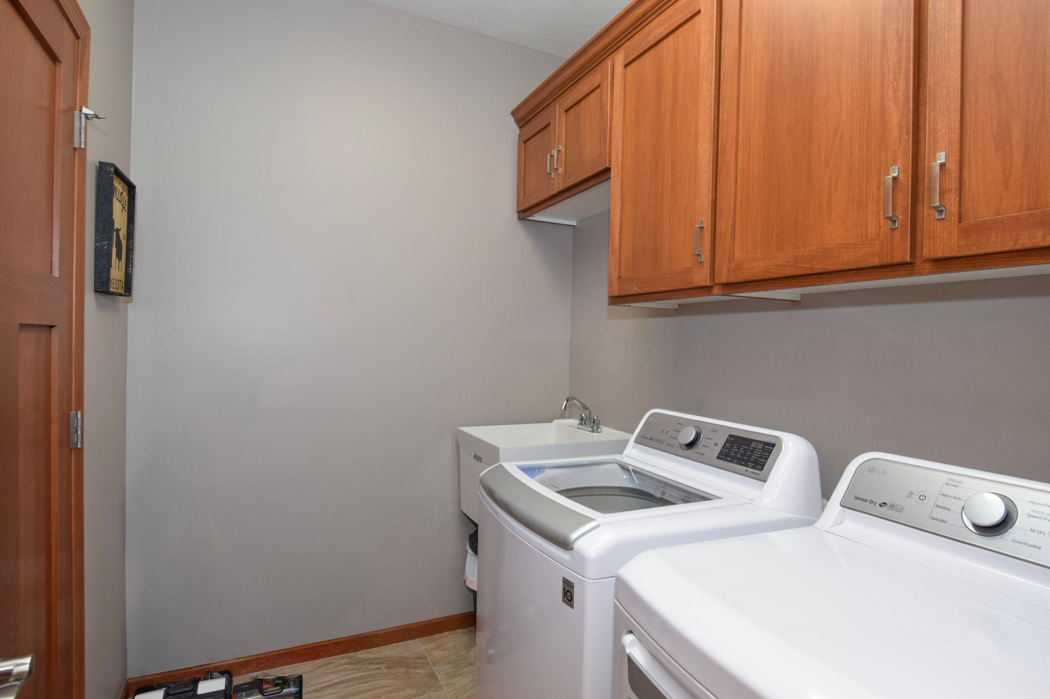 The Laundry Room IS A REAL ROOM Complete WITH A SINK AND CABINETRY!!! Washer & Dryer ARE Included!