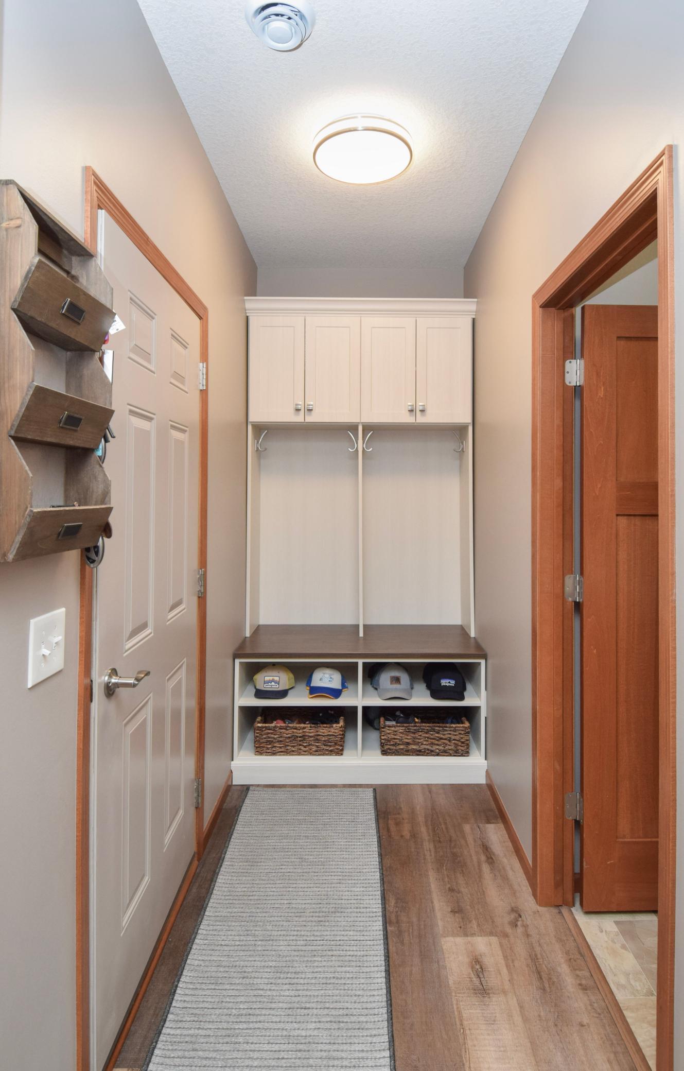 Revisiting the Garage Entry! Notice the Custom Locker System Designed Specifically for THIS Space and Stays with the Home!