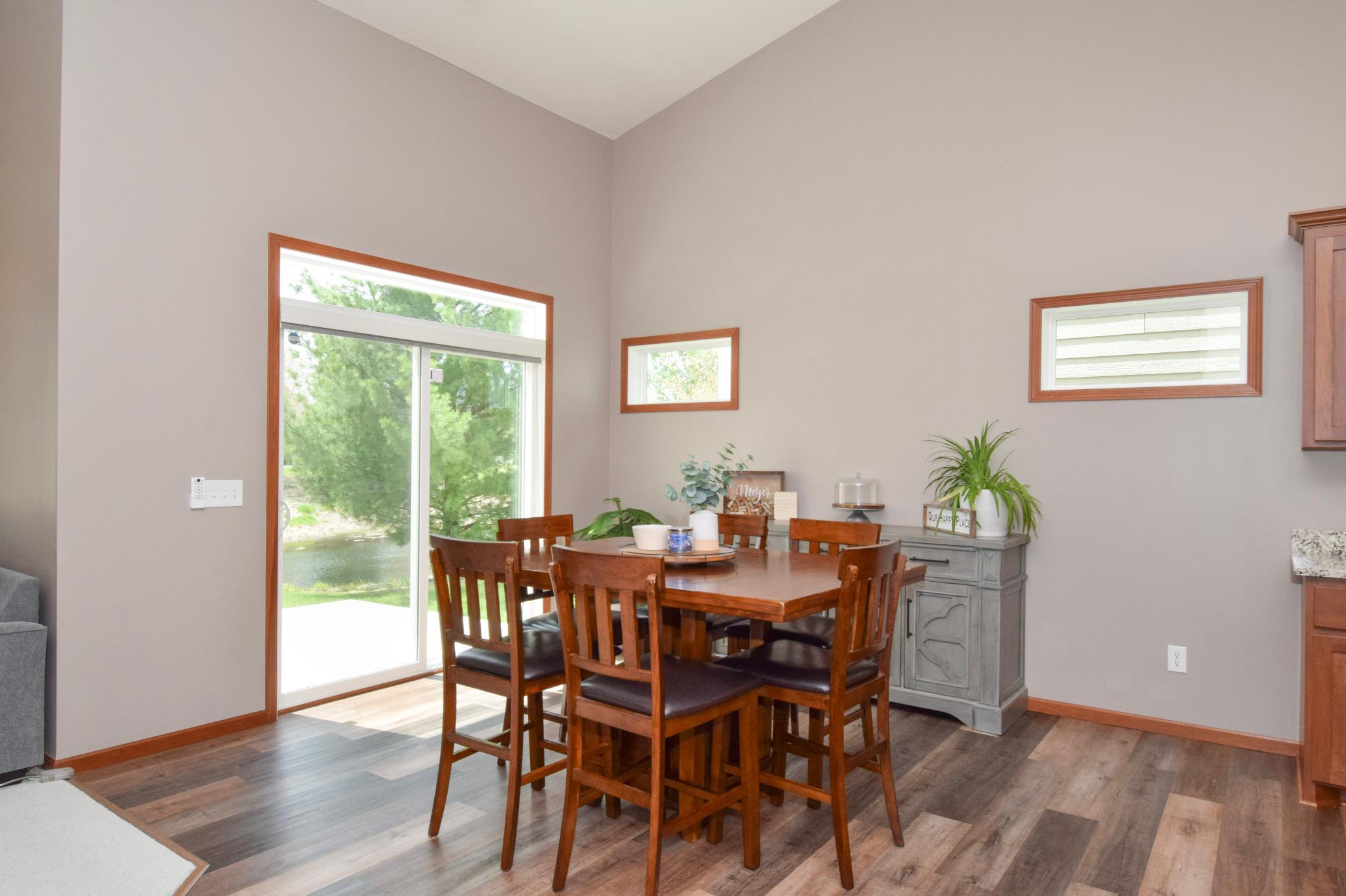 Transom Windows Above the Patio Door and Two More Flank the Southwest Side Drenching Your Rooms in Natural Light!