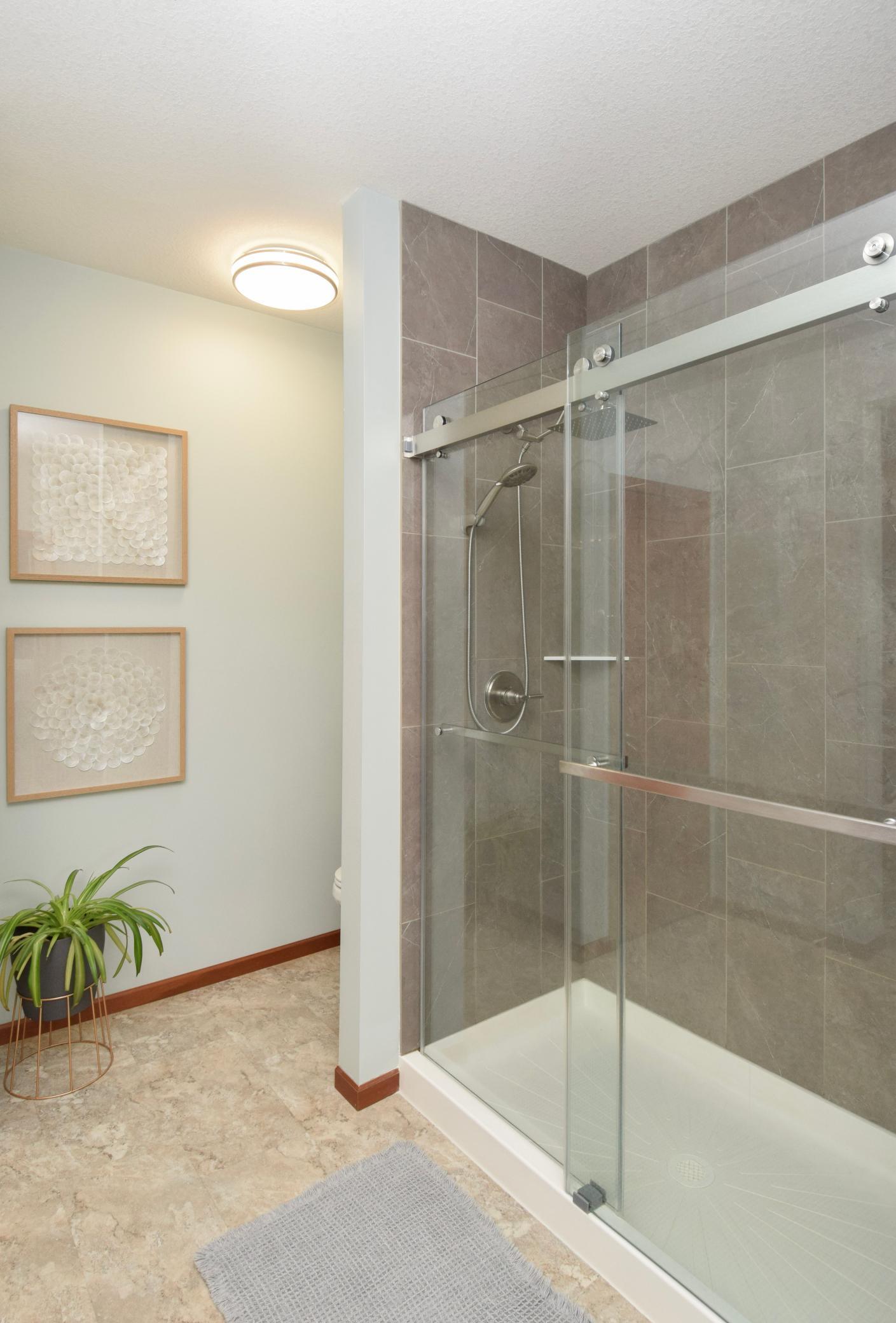 A Walk In Primary Closet Generously Sized Enough to Hold a Dresser As Well-See When You Visit! Shower Doors Glide Like Butter!