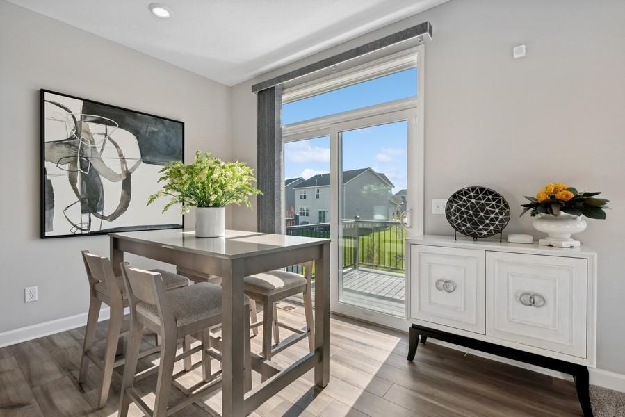 (Photo of a decorated model, actual features will vary) Soaked in natural sunlight, the homes eat-in dining room has ample space for a dining table located in the heart of the home.