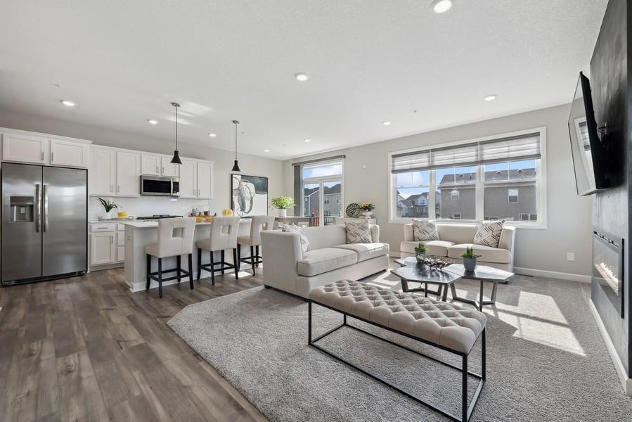 (Photo of a decorated model, actual features will vary) The spacious and open-concept main level allows for optimal versatility and comfort.