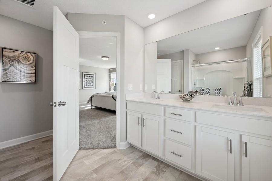 (Photo of a decorated model, actual features will vary) An extension of the owner's suite, this private and spacious bath includes a double-vanity and a large shower.