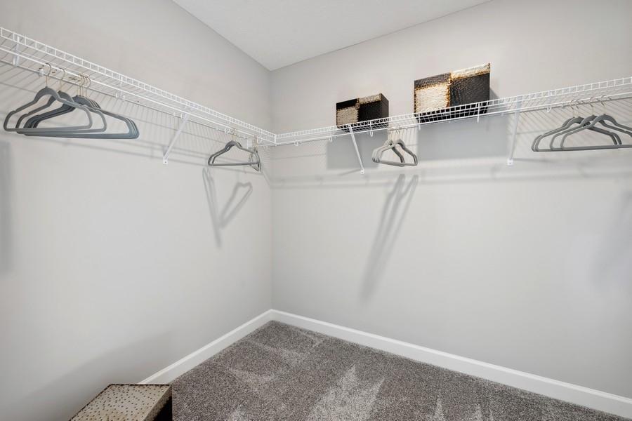 (Photo of a decorated model, actual features will vary) The owner's suite features an incredible walk-in closet.