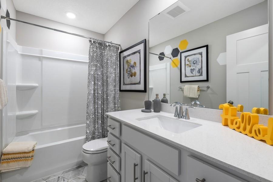 (Photo of a decorated model, actual features will vary) The secondary bath provides that needed extra space!
